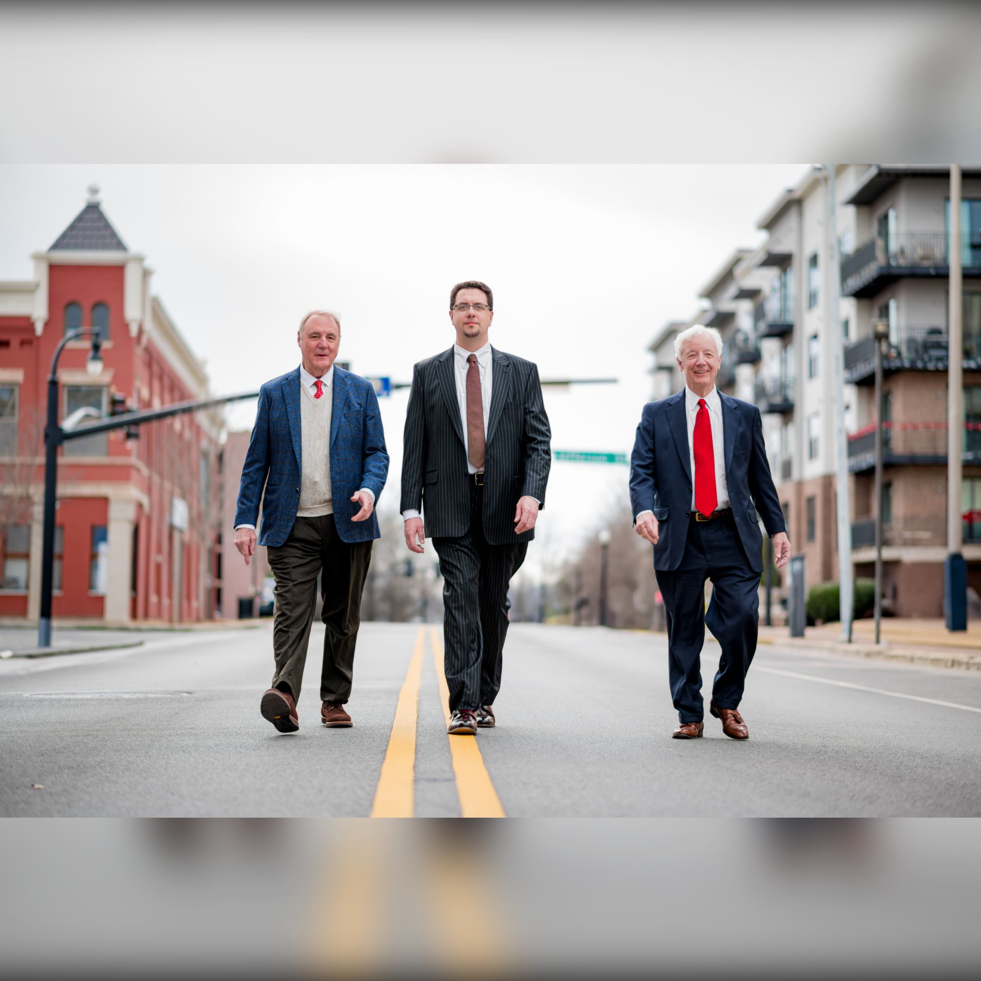 The attorneys of Johnston, Moore & Weston walking in downtown Huntsville